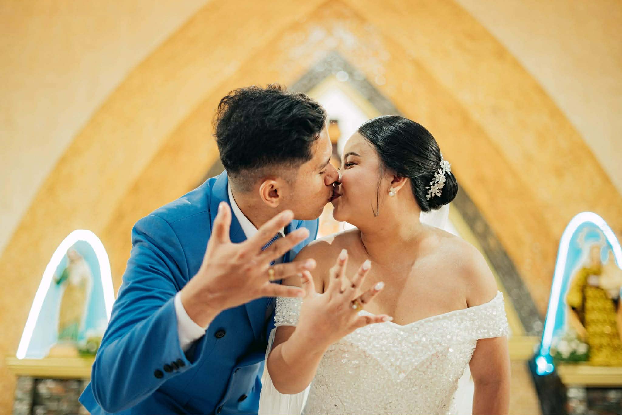 Wedding ceremony — couple kissing at the altar
